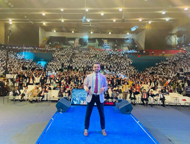 Trivro AI founder on stage at large-scale entrepreneur summit
